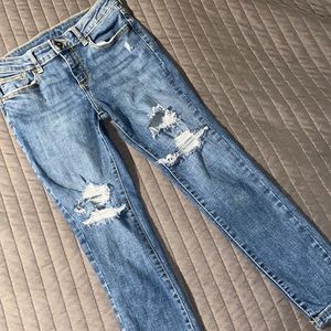 Young girl Distressed blue jeans